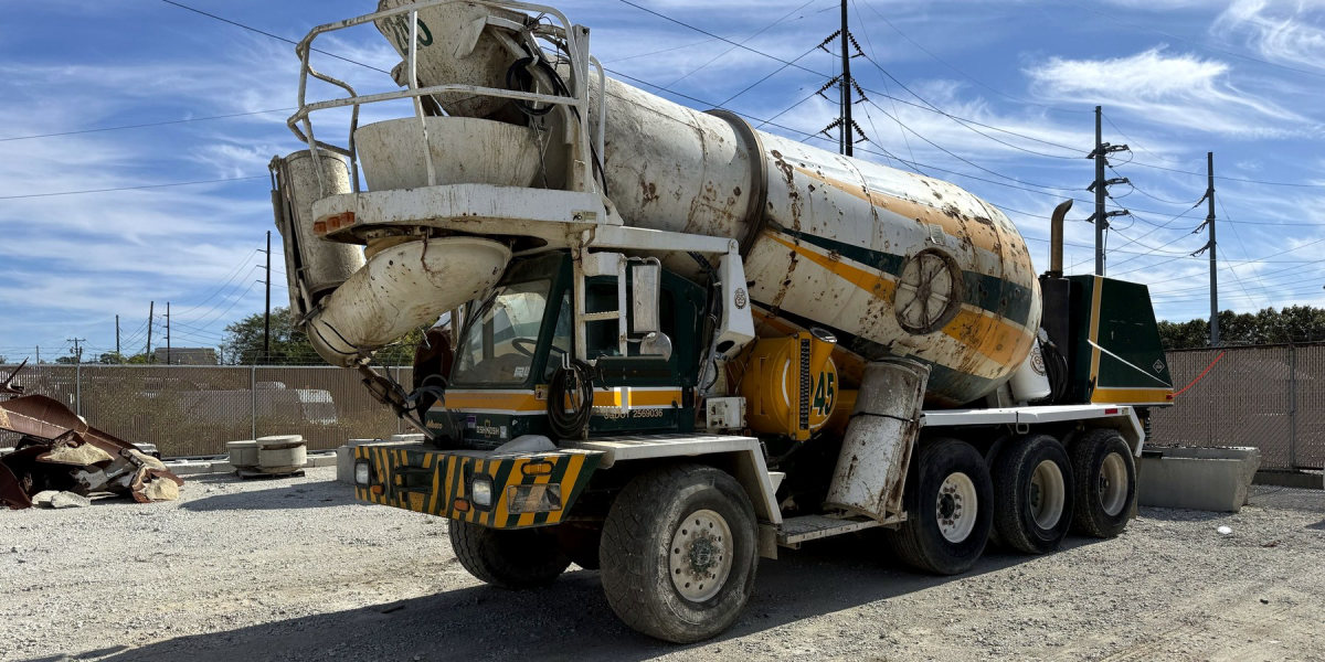 2011 Oshkosh front discharge concrete mixer truck, driver-side front quarter (stock TM-245)